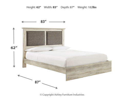 Cambeck King Upholstered Panel Bed with Mirrored Dresser