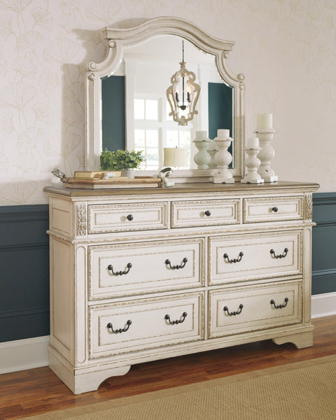 Realyn California King Upholstered Panel Bed with Mirrored Dresser and Chest