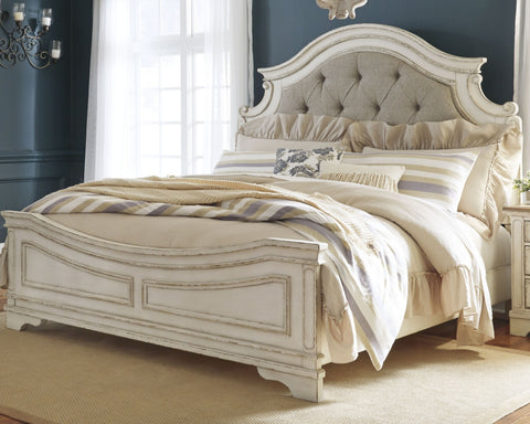 Realyn California King Upholstered Panel Bed with Mirrored Dresser and Chest